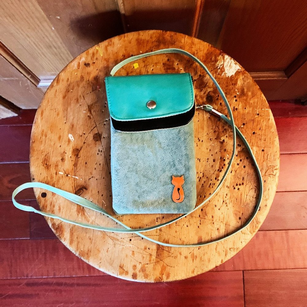 Blue purse with long strap